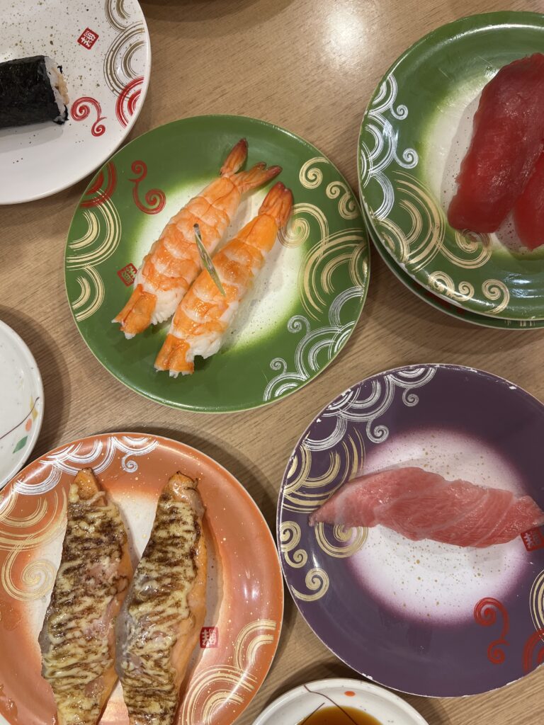 Colorful sushi plates at Triton Sushi in Sapporo