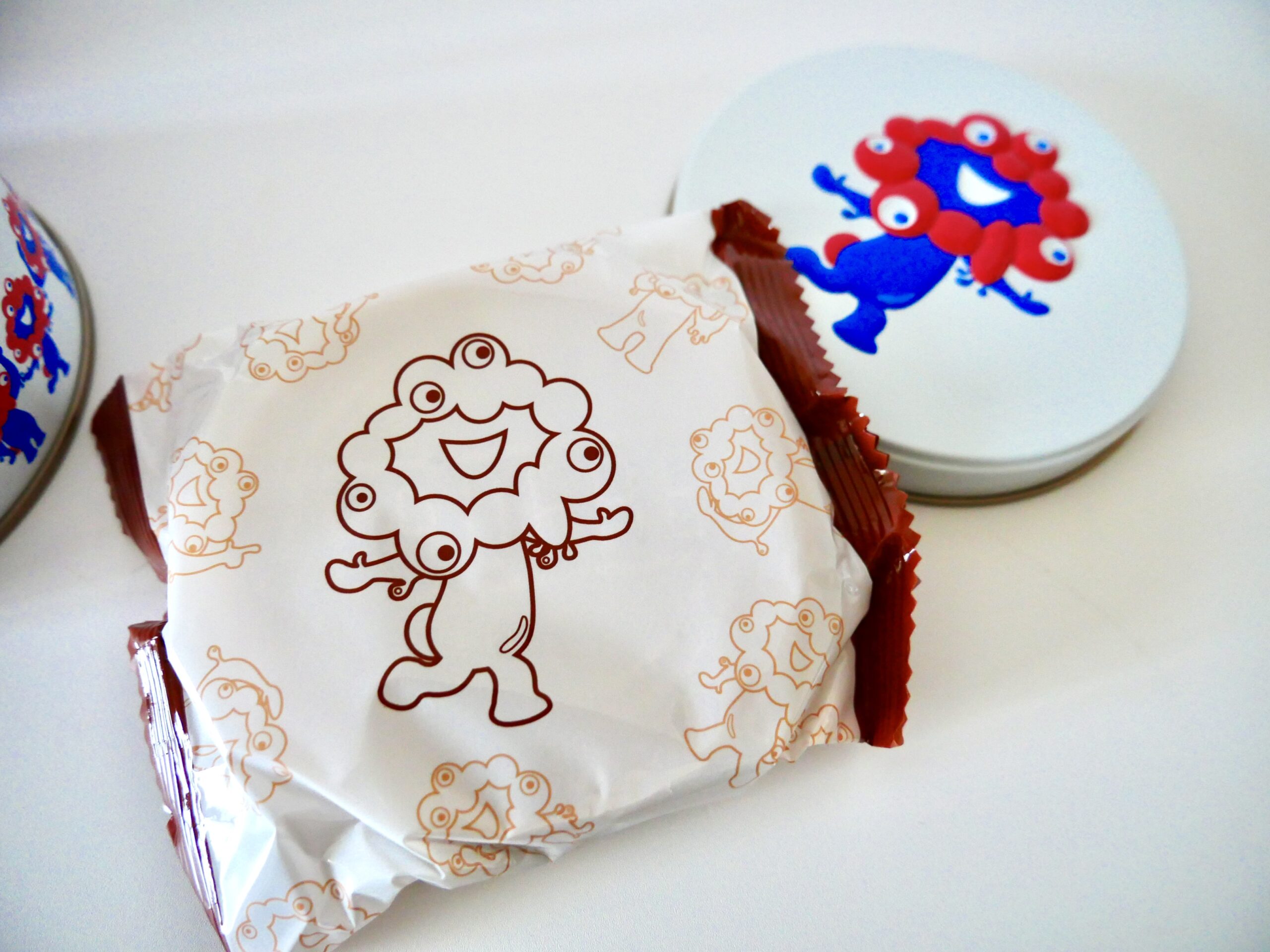 Close-up of an individually wrapped Expo 2025 Mini Gaufre featuring the mascot.