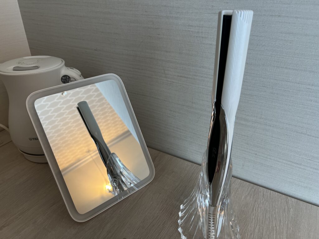 ReFa hair iron and mirror provided in the guest room at Hotel Universal Port Vita.