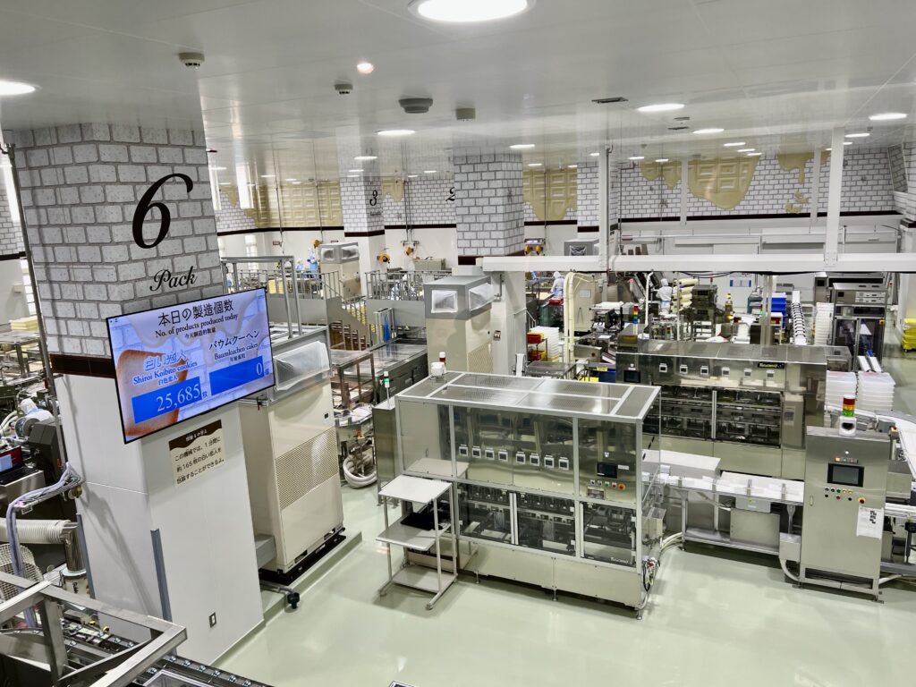 Visitors watching the Shiroi Koibito cookie production line during the factory tour at Shiroi Koibito Park, Sapporo